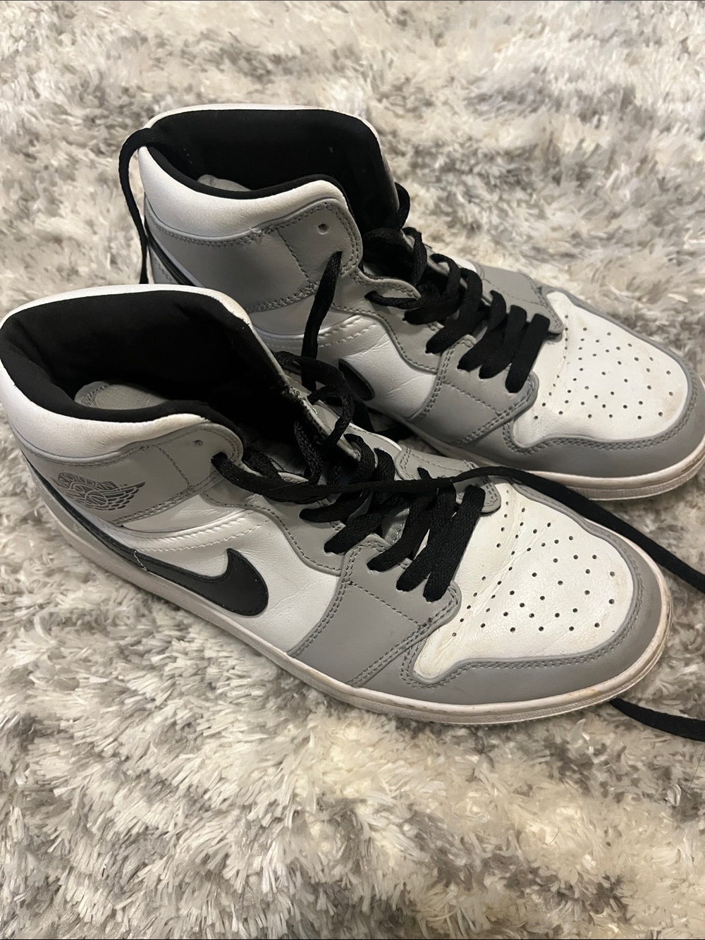 Nike women’s Air Jordan High-Top Sneakers in White, Gray and Black